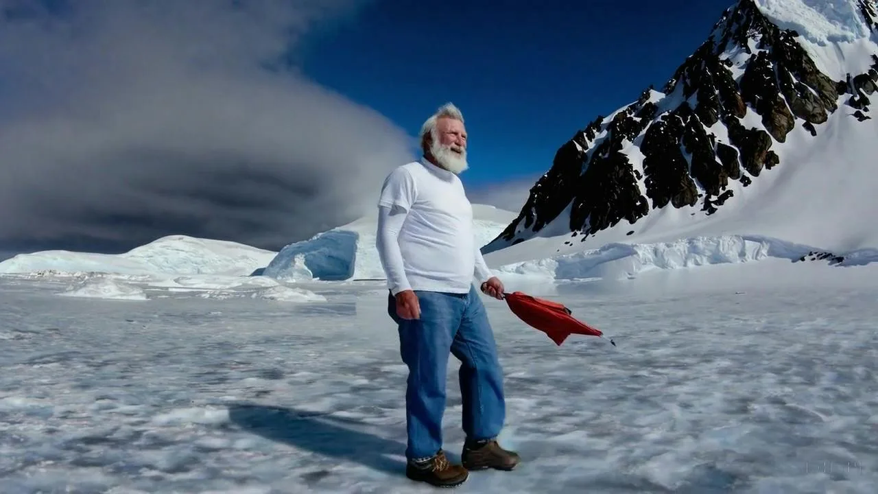Sora-generated video still: man standing in a snowy mountain landscape